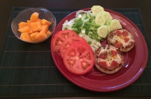 mini pizzas salad and melon